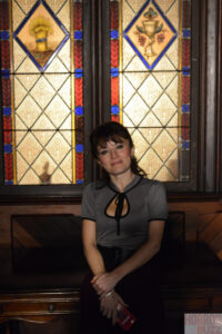 Elif in front of stained glass